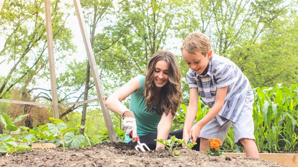 grow-your-own-vegetable-garden-mother-and-son-planting-5948286193