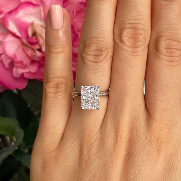 girl wearing classic solitaire cut diamond ring