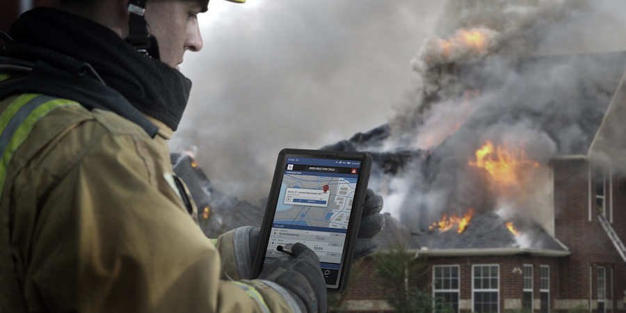 firefighter-using-tablet-outside-fire